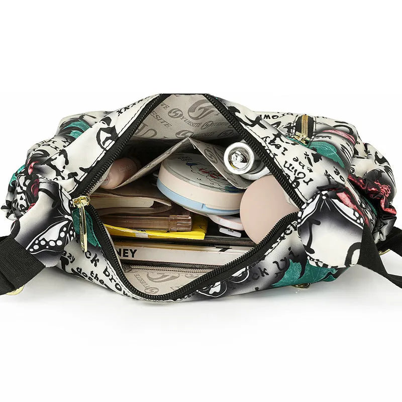 Graffiti casual crossbody bag in nylon with sewing line and print details, medium-soft build, single strap, dumpling shape