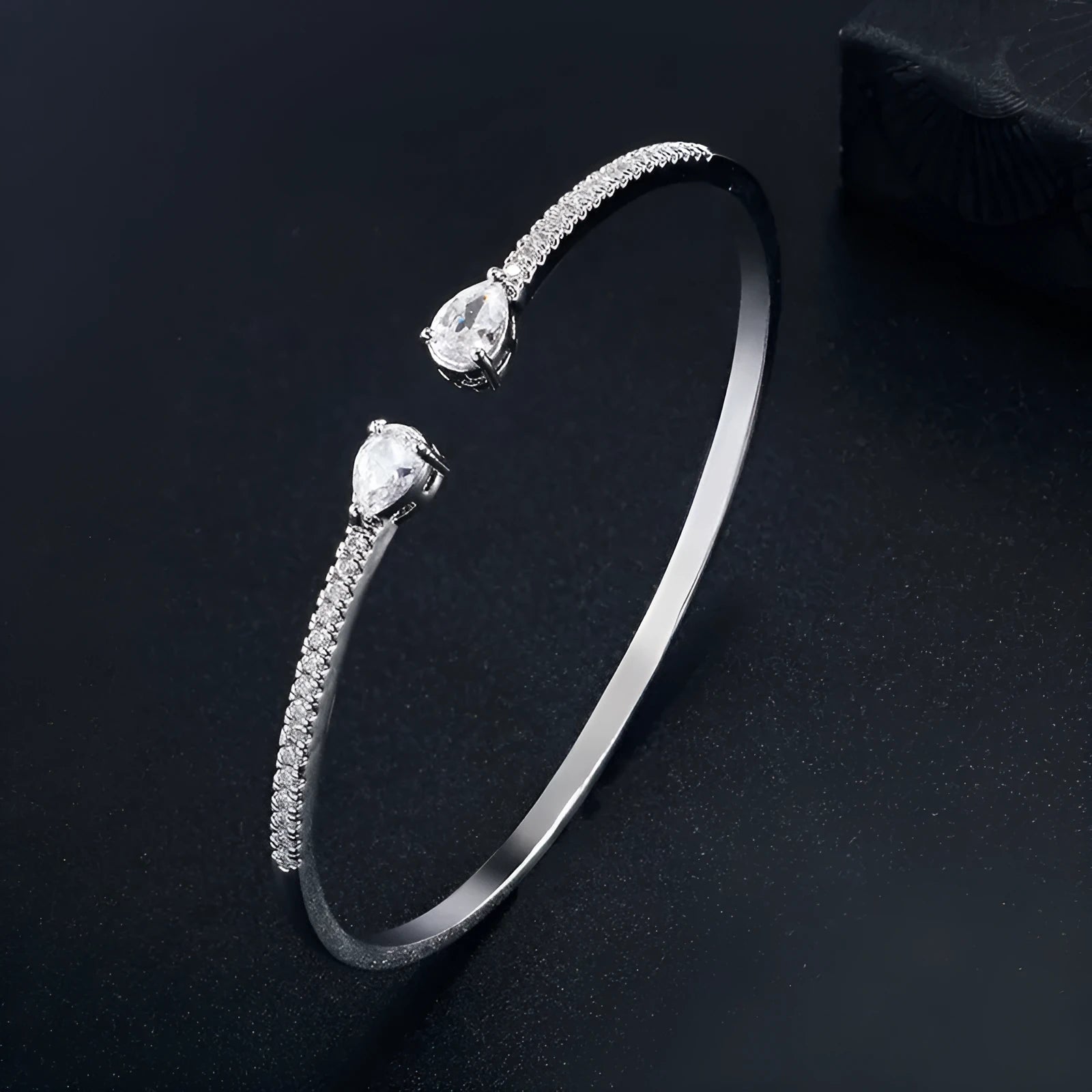 Copper bracelet with inlaid zircon treatment in blue and white colour options