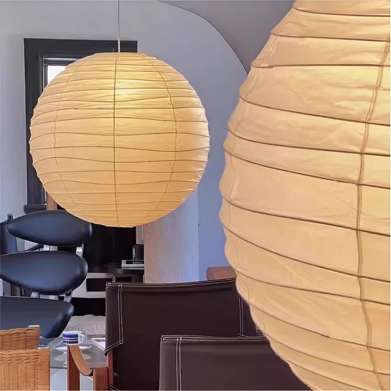 Japanese style rice paper ceiling chandelier lamp with a natural shade in a living room setting.
