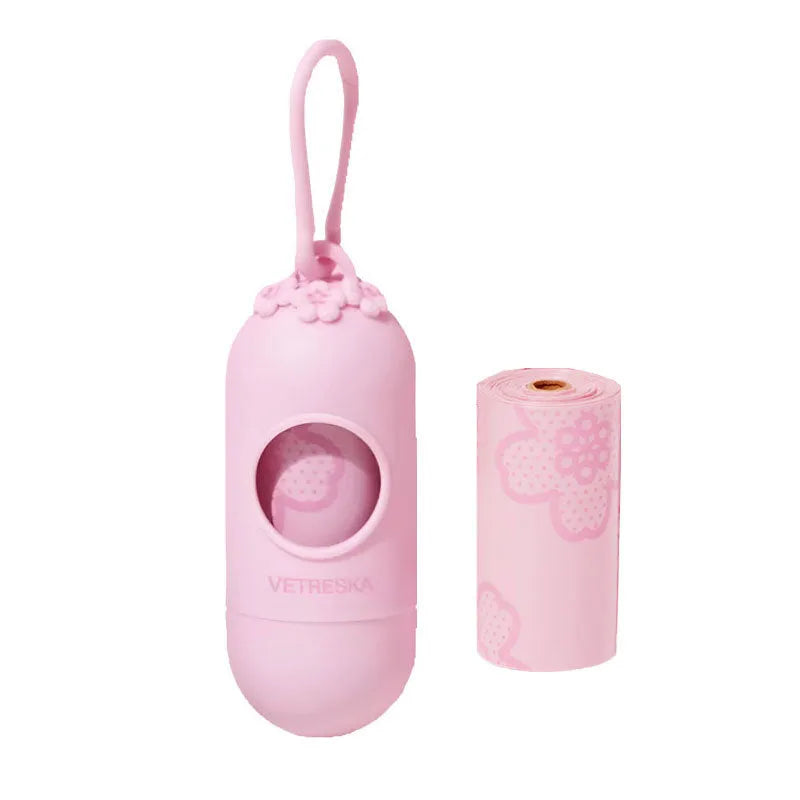 Dog waste bag dispenser capsule with a roll of scented bags in strawberry, orange, or cherry blossom design.