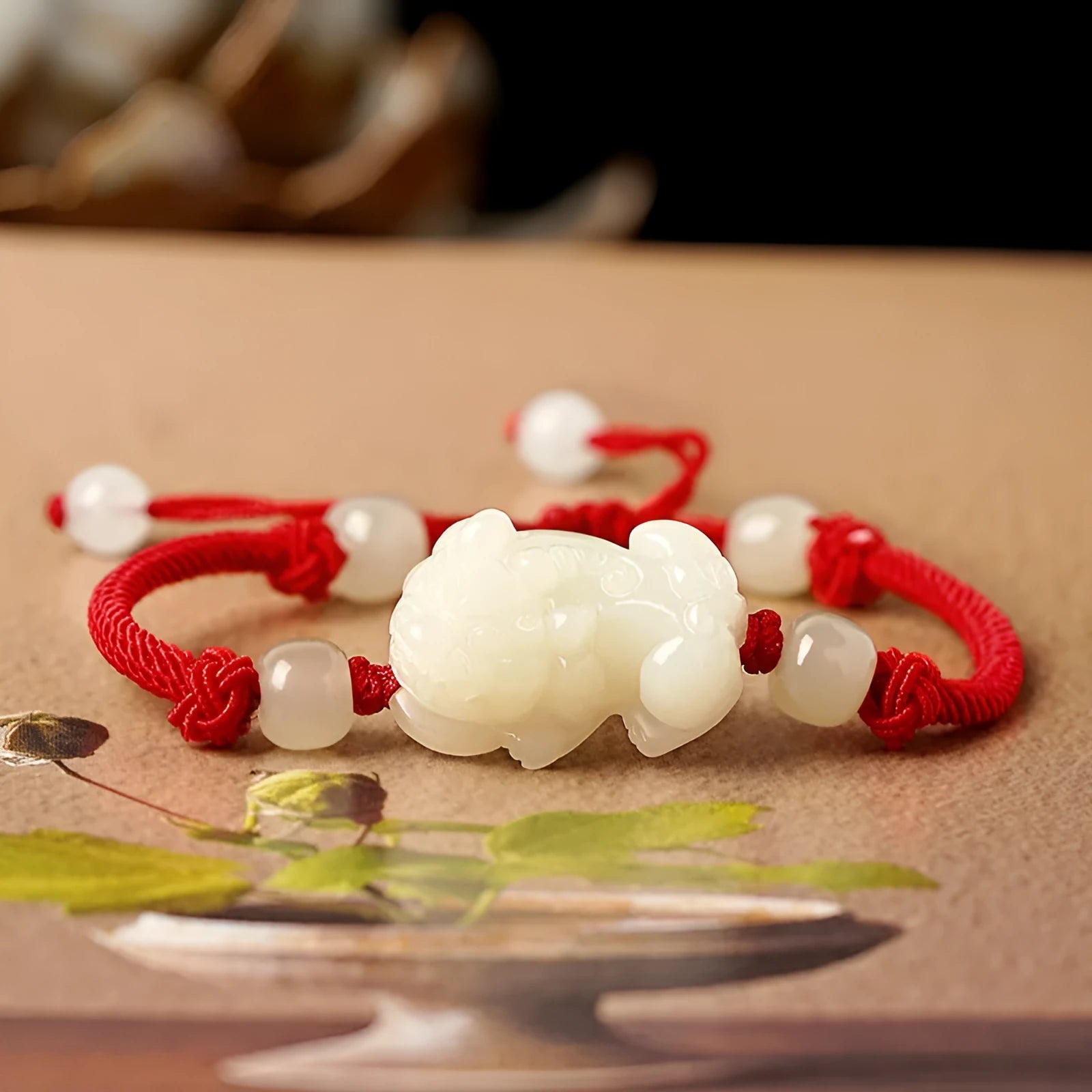 Hetian jade bracelet with braided rope closure in traditional Chinese style