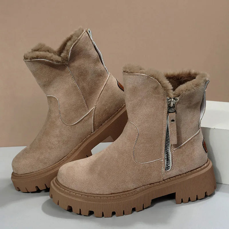 Women's black high-top snow boots with a side zipper and faux suede upper on a rubber sole.