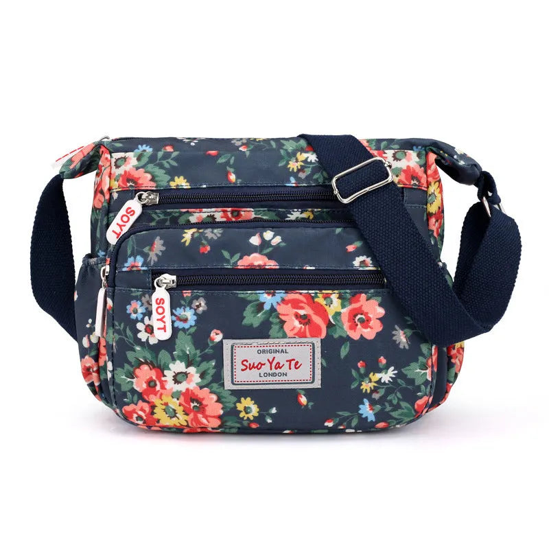 Lightweight printed nylon shoulder bag with double straps and floral or butterfly design