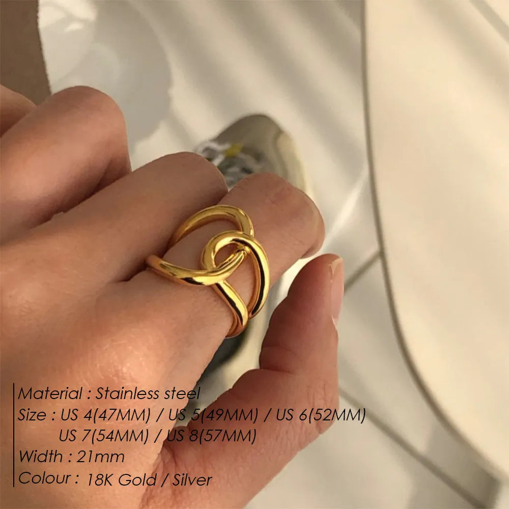 Women's adjustable stainless steel ring with knotted geometric design in gold or steel colour.