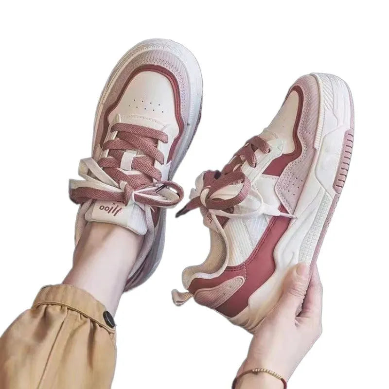 Women's beige and pink low-top rubber sneakers with height-increasing sole on a white background