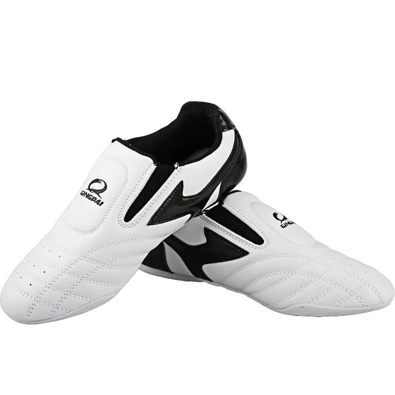 Black and white children's martial arts training shoes with a soft sole and widened design.