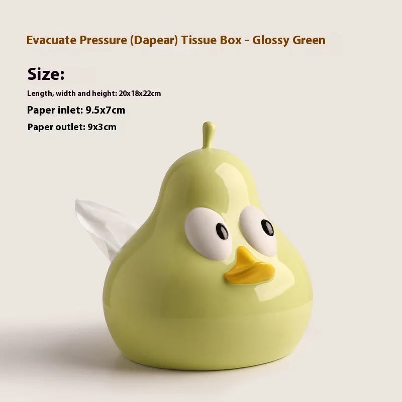 White porcelain pear-shaped tissue box holder in green colour on wooden surface