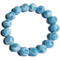 Blue and natural toned handmade bodhi bracelet with sea-pattern stones and pearl elements