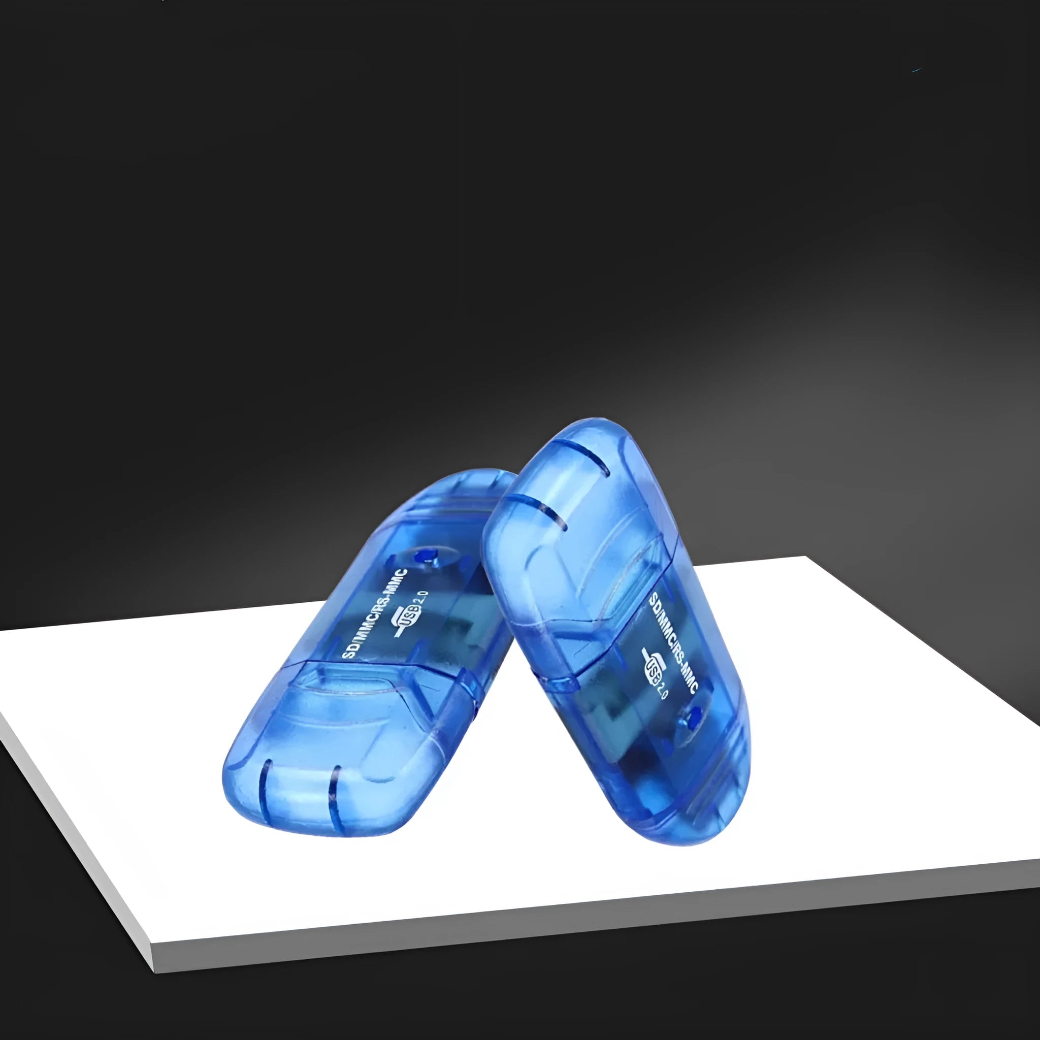 Transparent plastic USB card reader with LED light on a desk