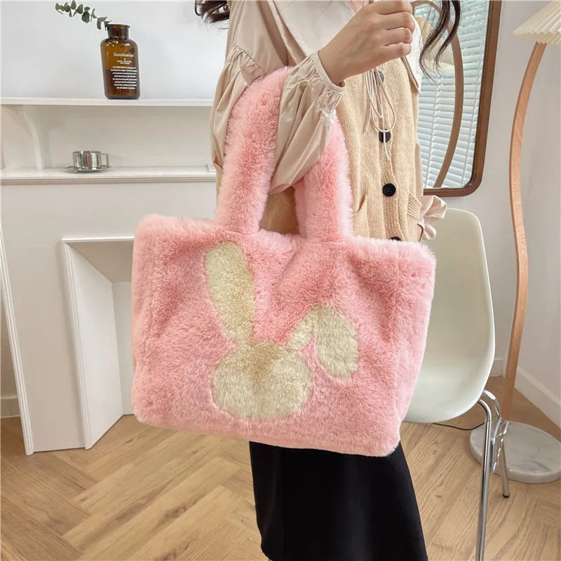 Plush shoulder bag with cartoon rabbit ears design in solid colour options