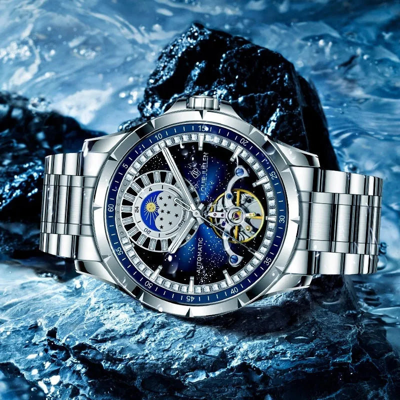 Men's silver alloy automatic watch with blue dial and stainless steel strap on wrist