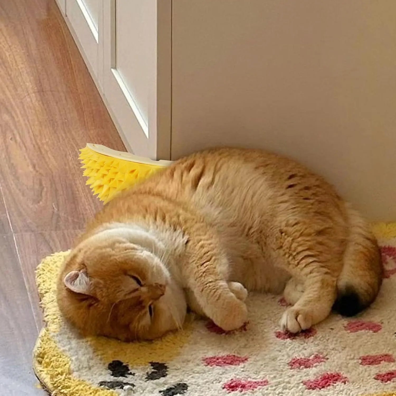 Yellow durian-shaped cat corner scratcher with massage comb surface mounted on wall