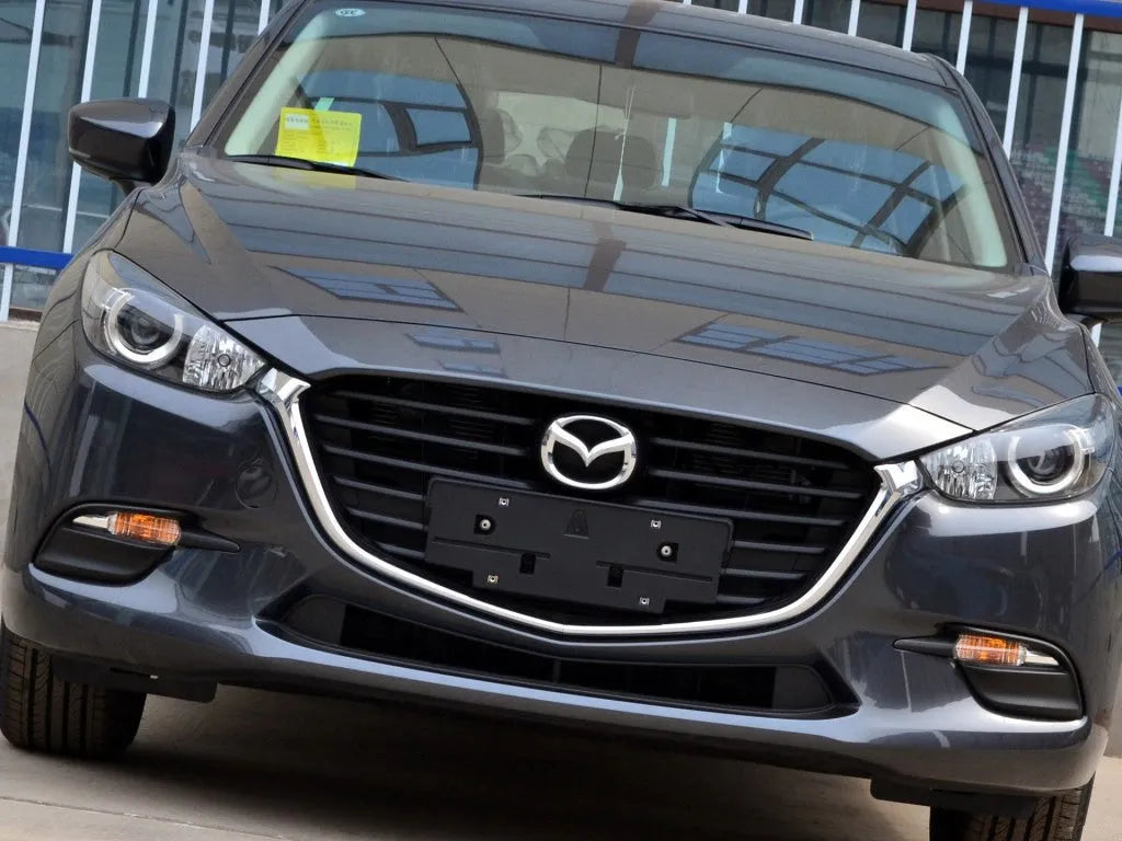 Mazda 3 Exela headlamp cover replacement part with snake glue adhesive for 14-16 or 17-19 models.
