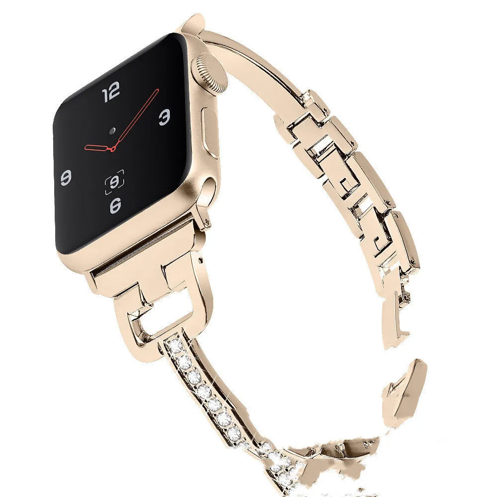D-shaped metal diamond-pattern strap for Apple Watch in gold colour next to a smartwatch.