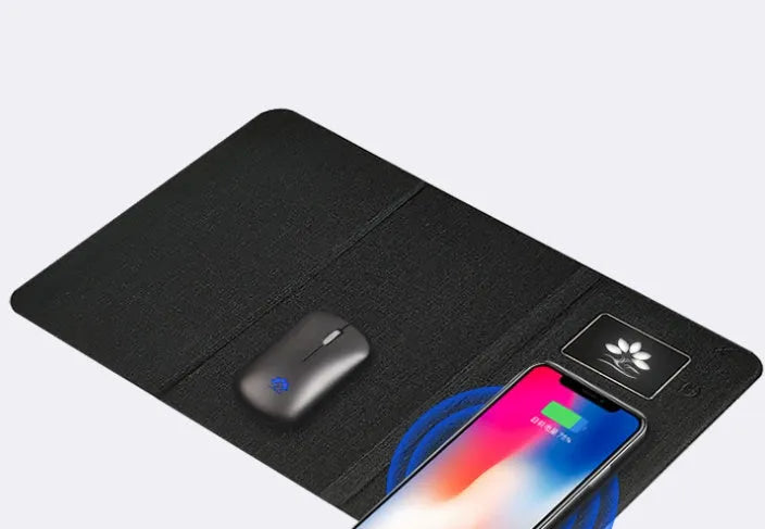 Folding wireless charging mouse pad set with Bluetooth mouse on desk, showing compact folded size