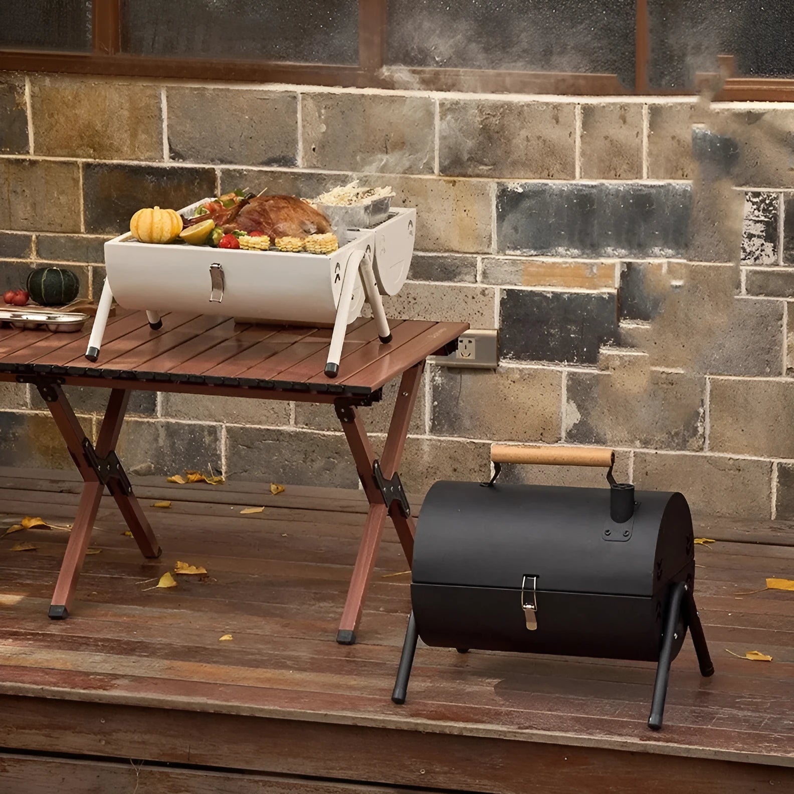 White portable folding barbecue grill with round chimney oven and cooking accessories