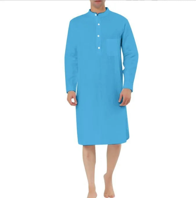 A man's long-sleeve cotton shirt robe in a light blue colour, showing a button front and chest pocket.