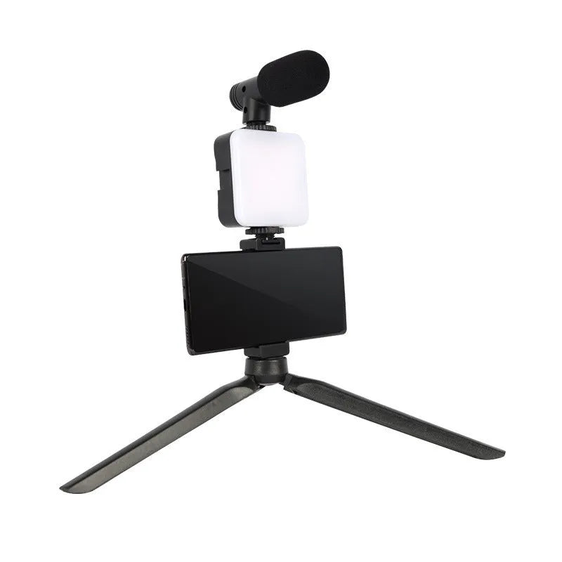 Mini square outdoor camera flash on a small tripod with a rotatable head