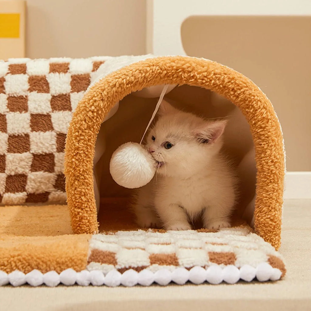 Large XL fan-shaped plush pet bed with integrated play tunnel in coffee colour, showing anti-slip base.