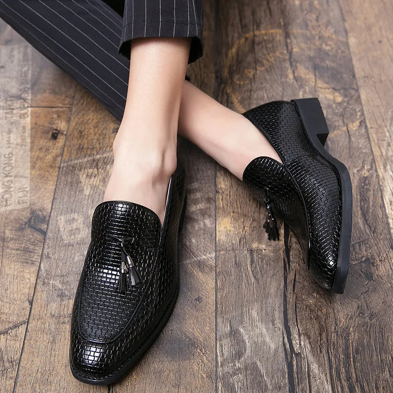Men's black pointed toe slip-on business shoes with decorative tassel on artificial PU upper