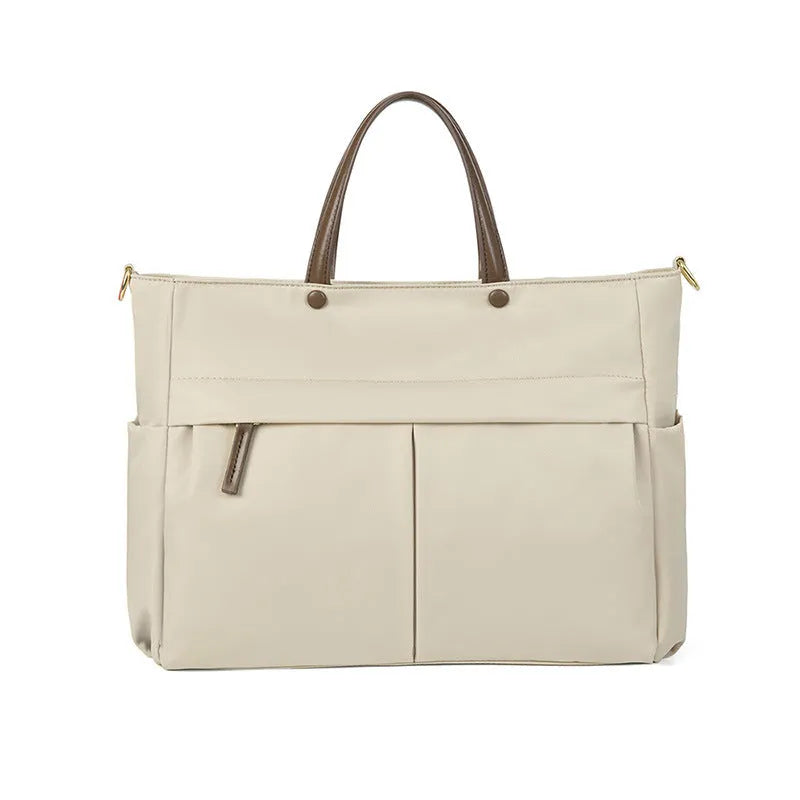 Women's Oxford cloth laptop bag with open pockets showing elegant black and nuts apricots colour options