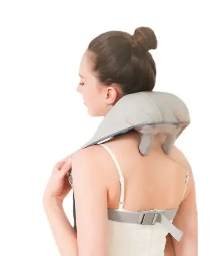 Milky white rechargeable shoulder and neck kneading massager with USB charging cable.