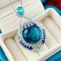 Blue geometric crystal pendant necklace with fireworks cut on a water wave chain for women