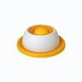 Yellow anti-spill slow feeder cat toy treat dispenser for cats on floor