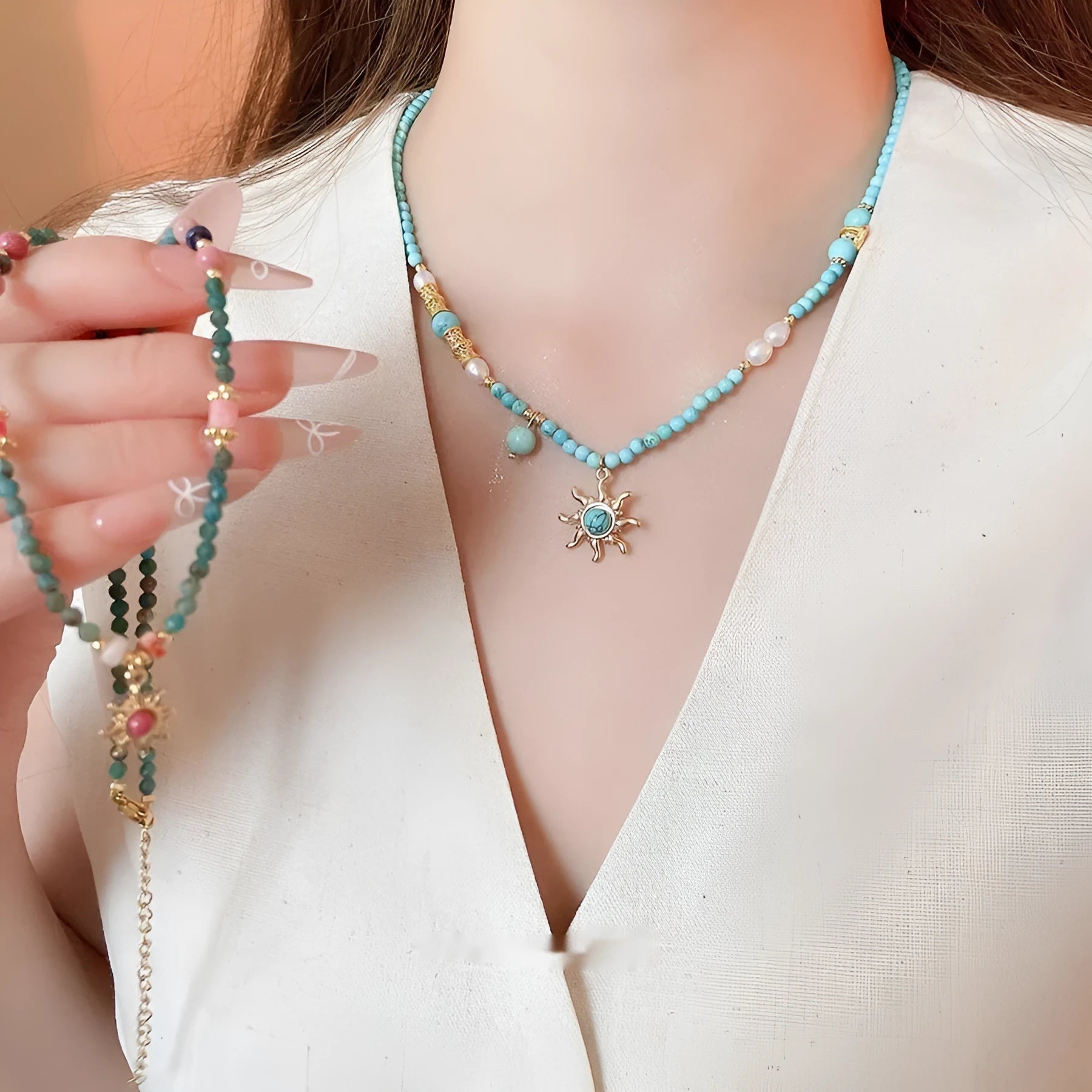 French royal court style necklace with freshwater pearls and a stone sun pendant on an adjustable chain.