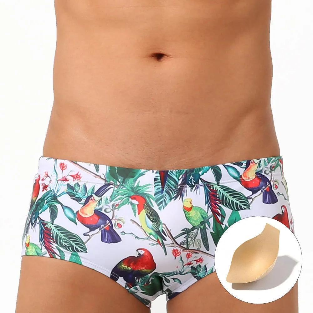 Men's navy swim trunks with white and red flower-bird print pattern, boxer briefs style