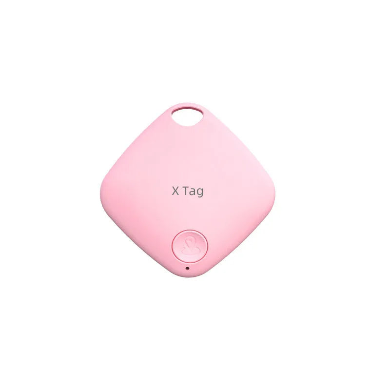 Small black Bluetooth tracker with key ring, shown next to a set of keys to illustrate size.