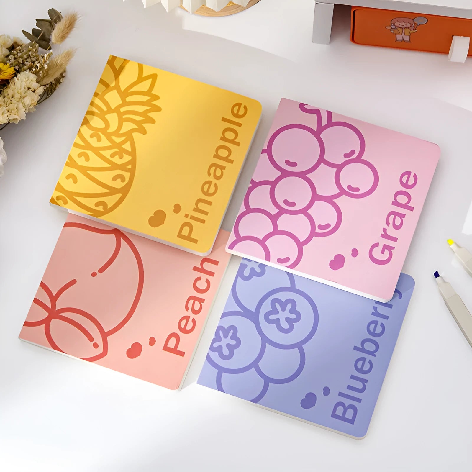 Square fruit notebook with embossed designs measuring 14.5x14.5cm