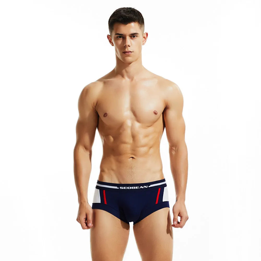 Men's low waist cotton boxers in dark blue, light grey, and red colours showing hip-lifting design