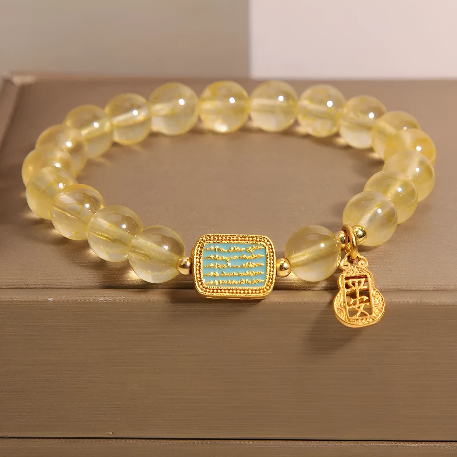 Women's natural citrine crystal bracelet with yellow colour and rhinestone detailing