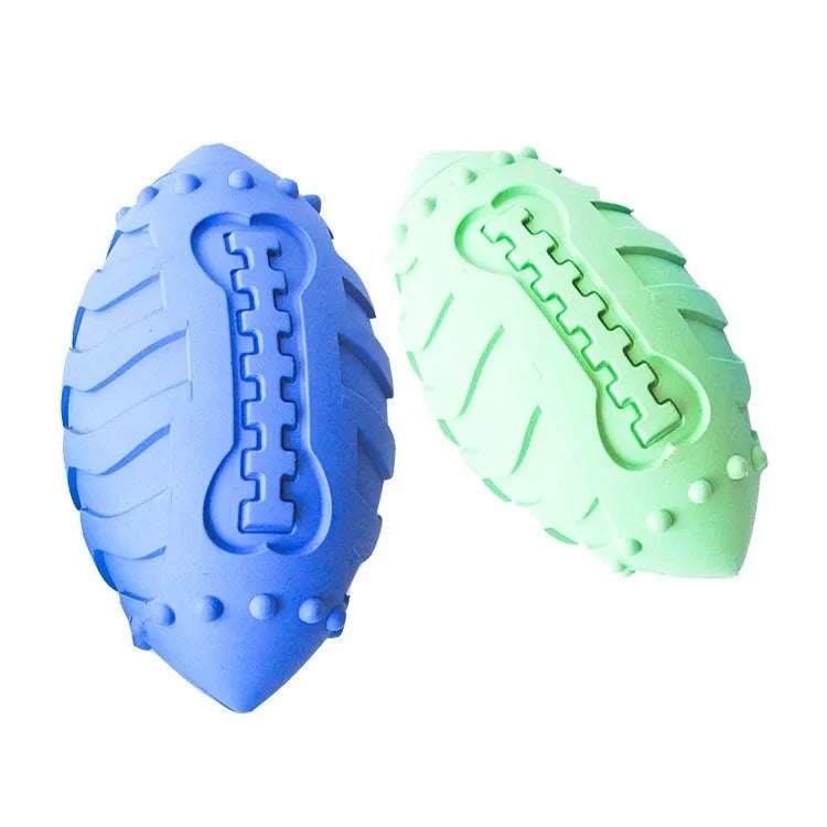 Light green rubber rugby ball dog toy with textured surface for teeth cleaning and training
