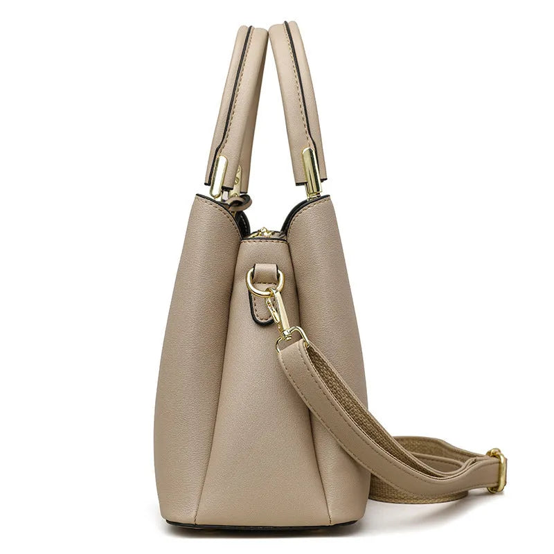 Women's black PU leather multi-compartment shoulder messenger bag with adjustable strap.