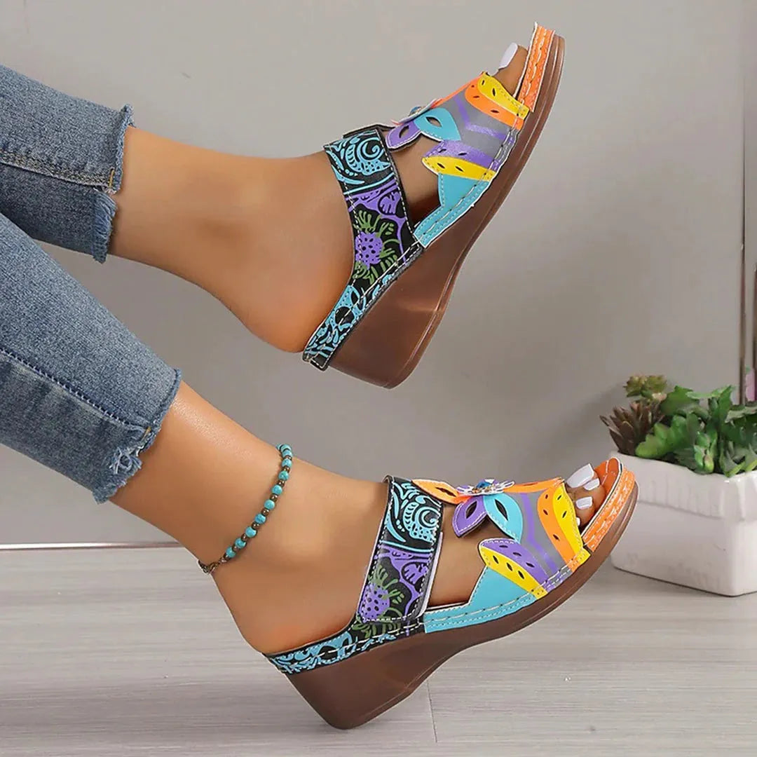 Colourful totem design slope heel sandals for women with cowhide upper and rubber sole.