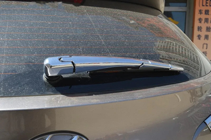 Set of four silvery ABS plastic rear window wiper cover trims for a 2010 Hyundai.