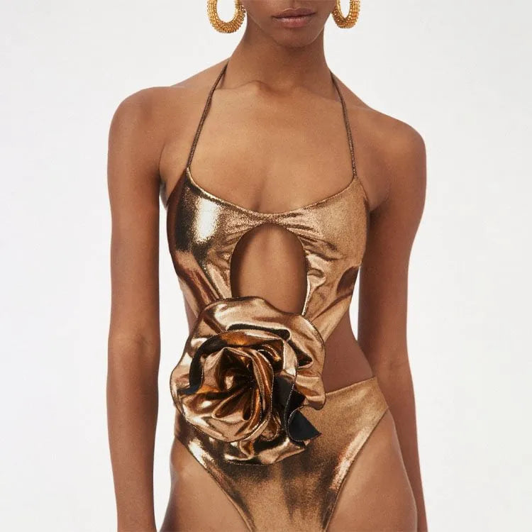 Gold handmade halter neck one-piece swimsuit with hollow-out design on mannequin