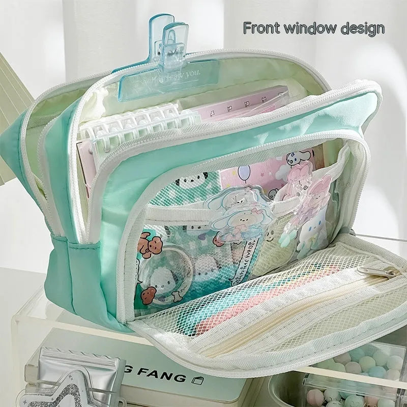 Double-layer pencil case in mint green with gift handle, showing internal divider for stationery organisation