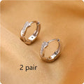 Geometric interwoven hemp rope earclip earrings with round bead accents in gold or silver colour