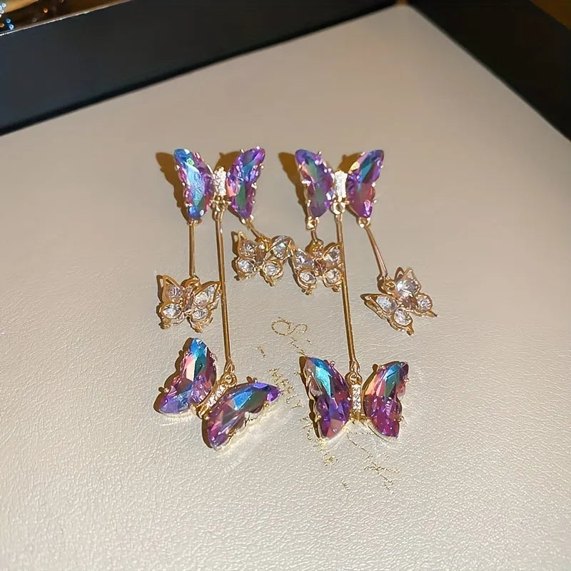Silver needle electroplated alloy earrings with blue purple butterfly tassel and crystal flower details