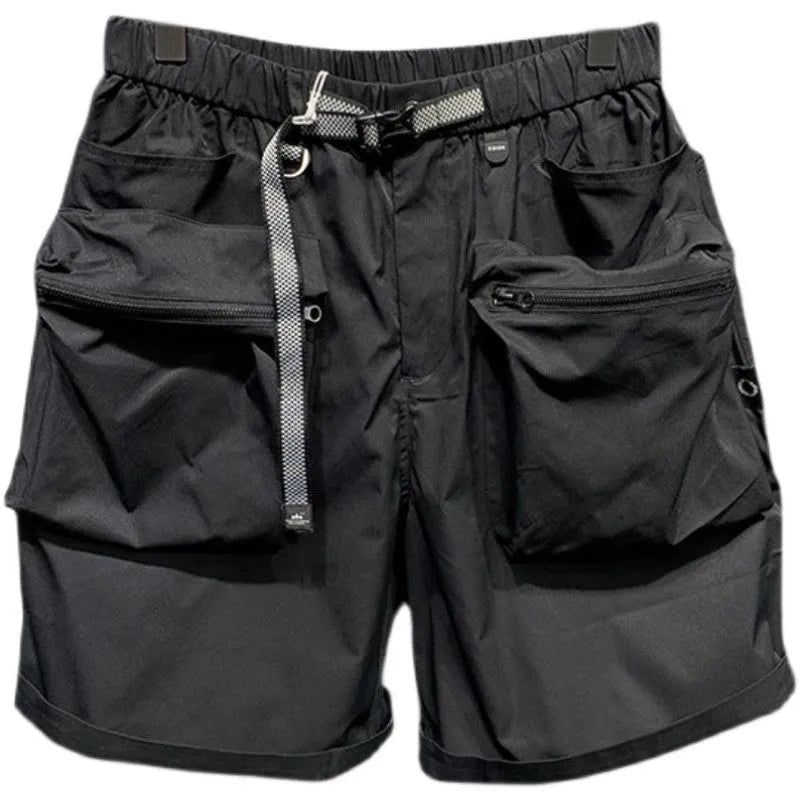 Men's loose-fitting black workwear shorts with pockets, featuring a non-iron finish and a mid-waist design.