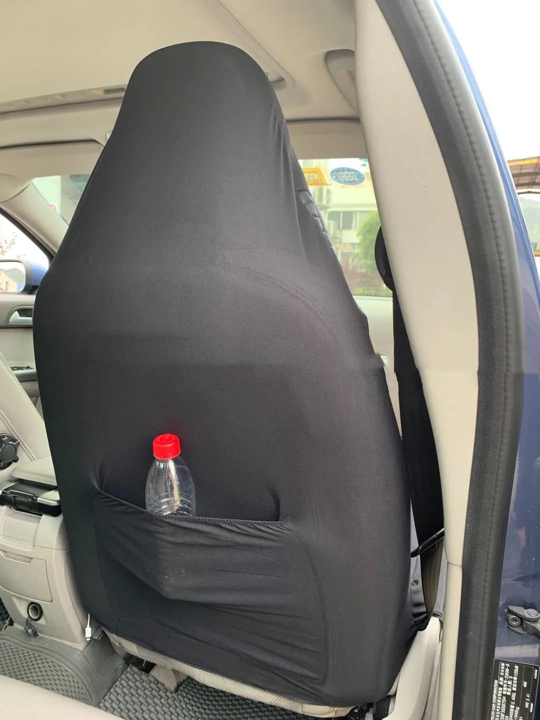 Black quilted automotive seat cover with universal fit for car protection