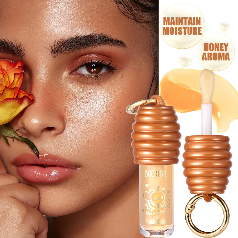 Honey lip gloss attached to keychain showing portable design