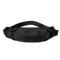 Black Oxford cloth crossbody waist pack with zippered opening showing interior organisation pockets