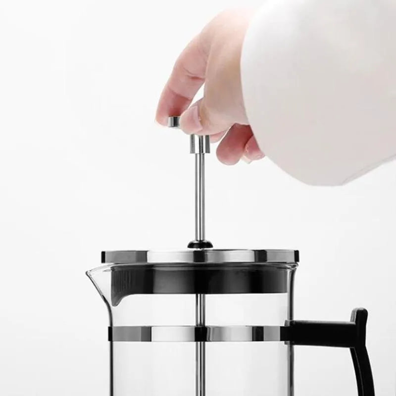 Manual glass and stainless steel pour-over coffee maker with 350ml capacity.
