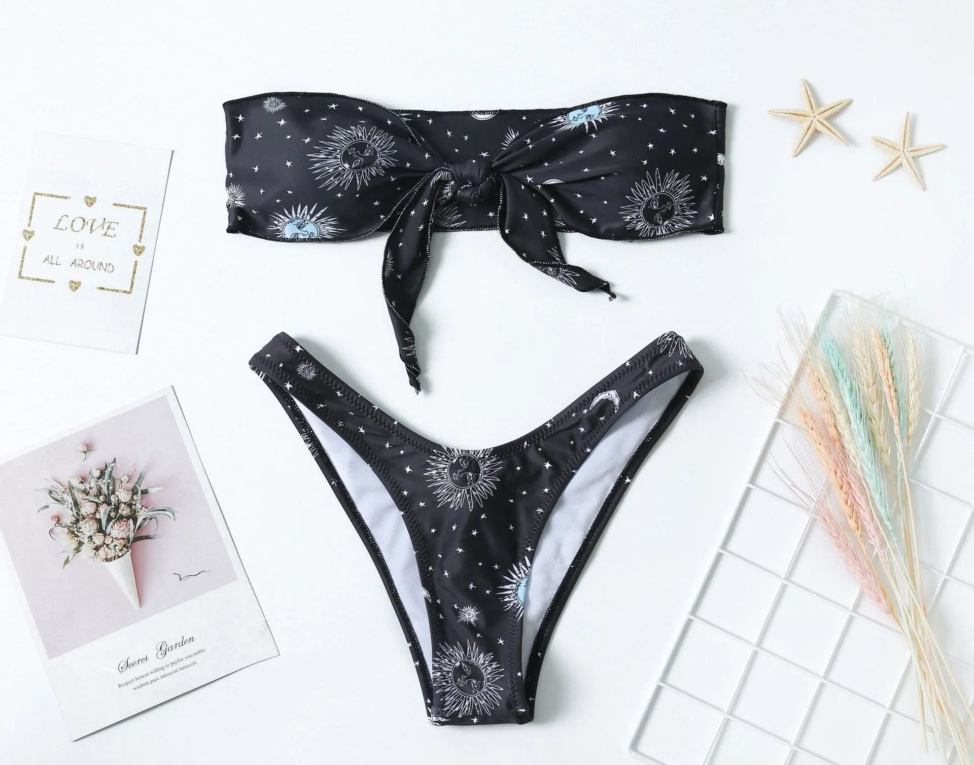 Black printed one-piece swimsuit with split tube top and backless design in nylon fabric