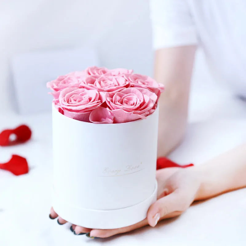 Handmade everlasting rose in hug bucket with preserved flower material, available in white red pink black blue colours