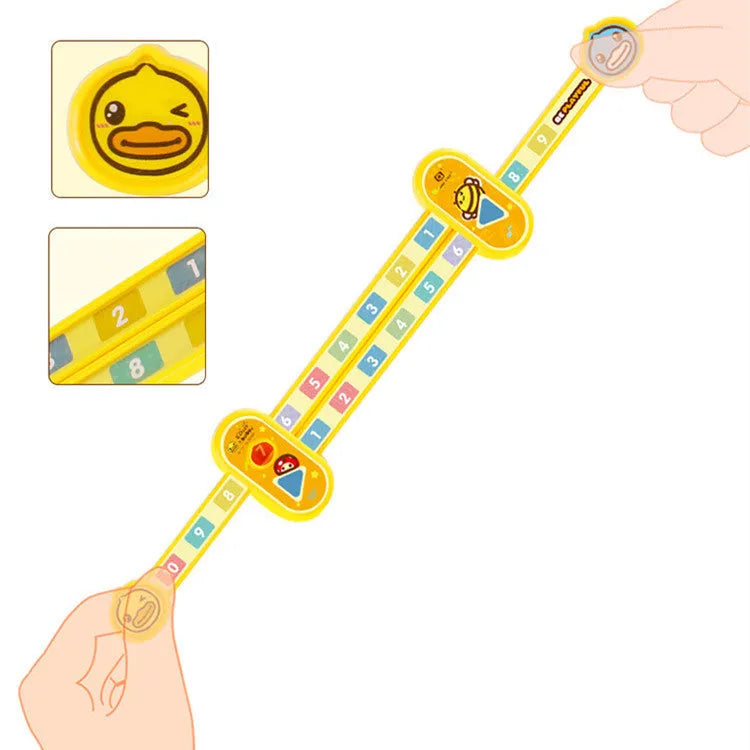 Yellow plastic children's digital resolution ruler with cartoon graphics, showing centimetre and millimetre scales.